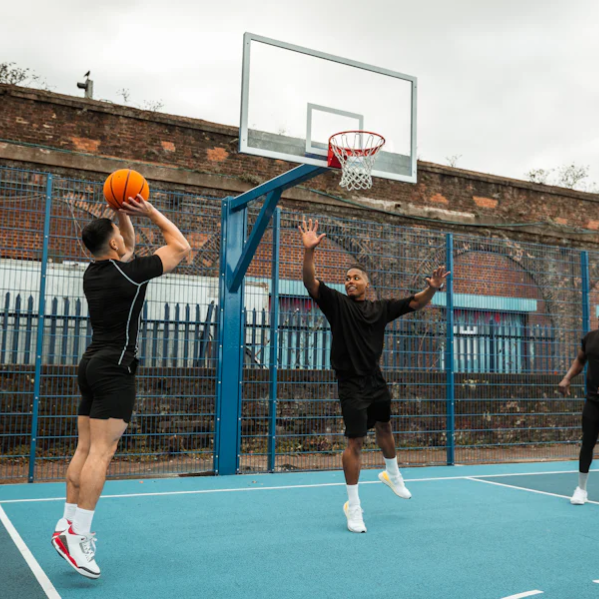 a group of boys playing basketball